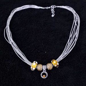 Silver Tone Strand Necklace With Gold and White Colored Charms‎  #1126 GOLD